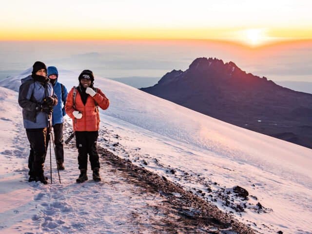 Trekkers on the Machame Route ridgeline under open sky